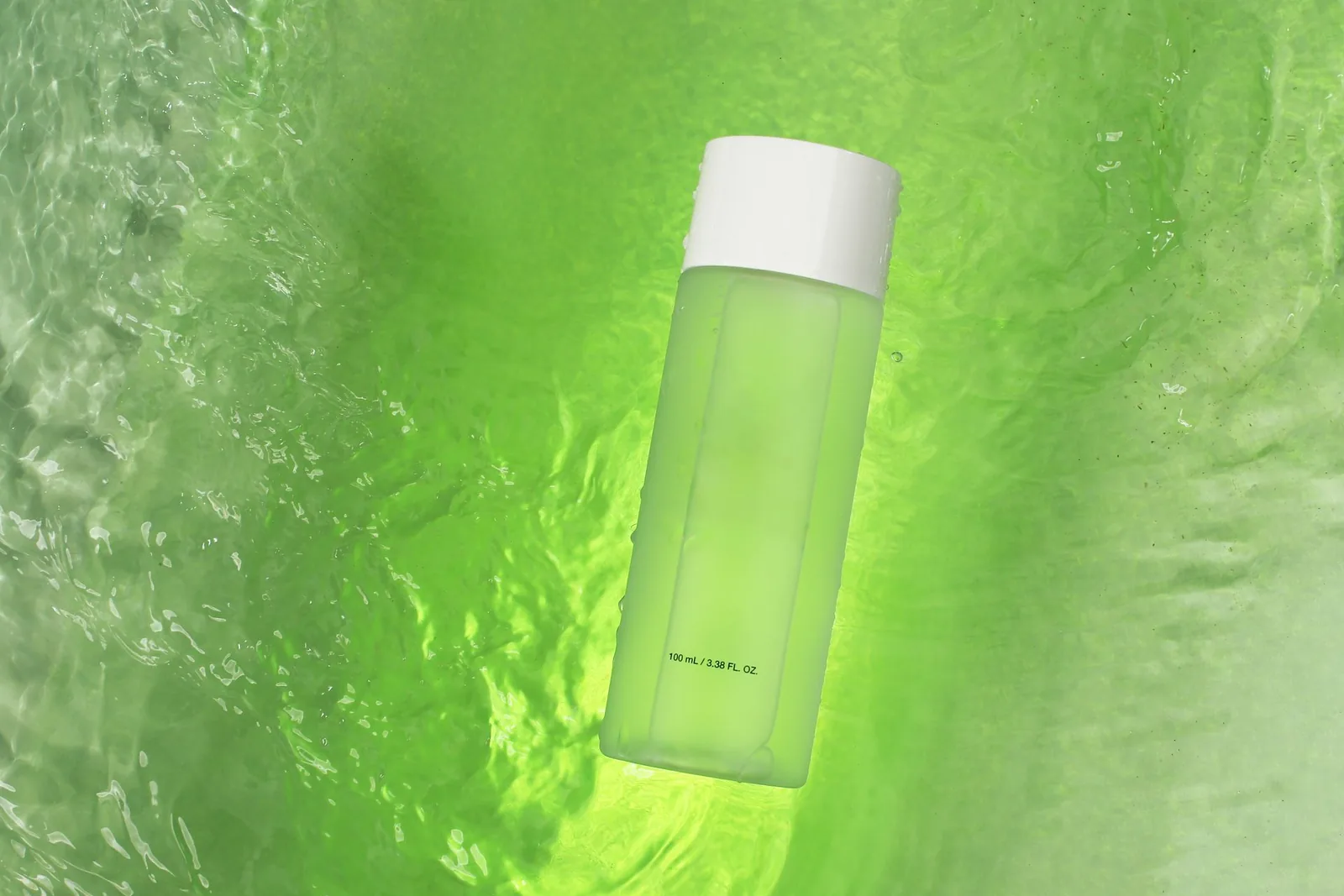 Pale green toner bottle with white cap floating on green water